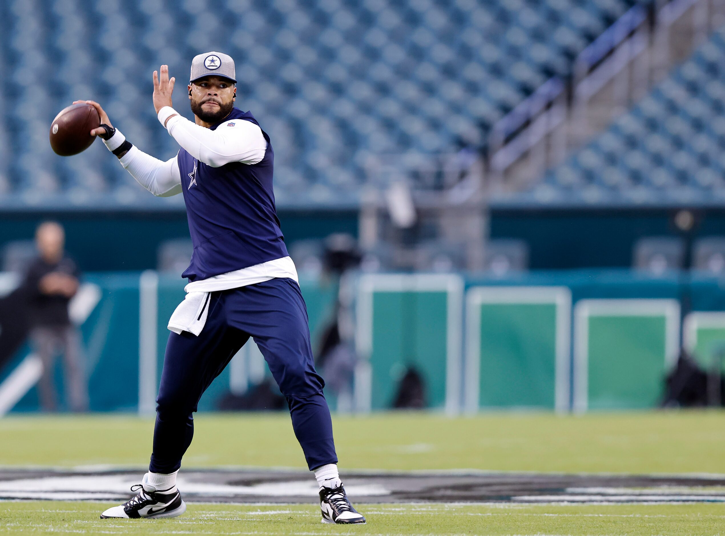 Dallas Cowboys quarterback Dak Prescott practices his throwing during pregame warmups at...