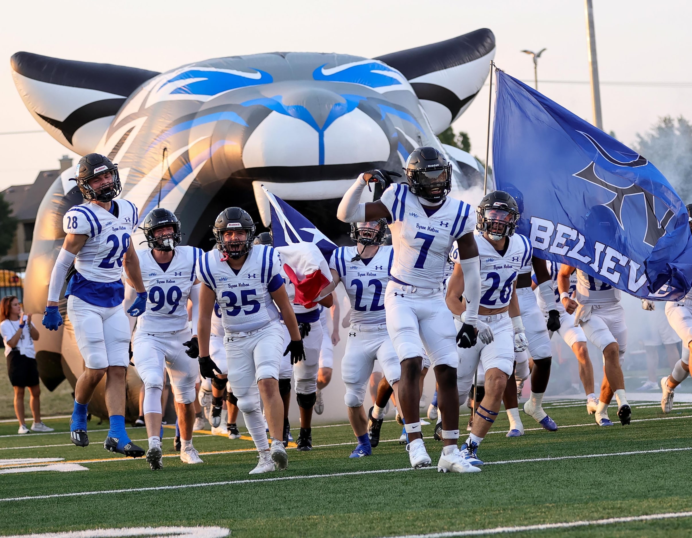 The Trophy Club Byron Nelson Bobcats enter the field to face Plano in a high school football...