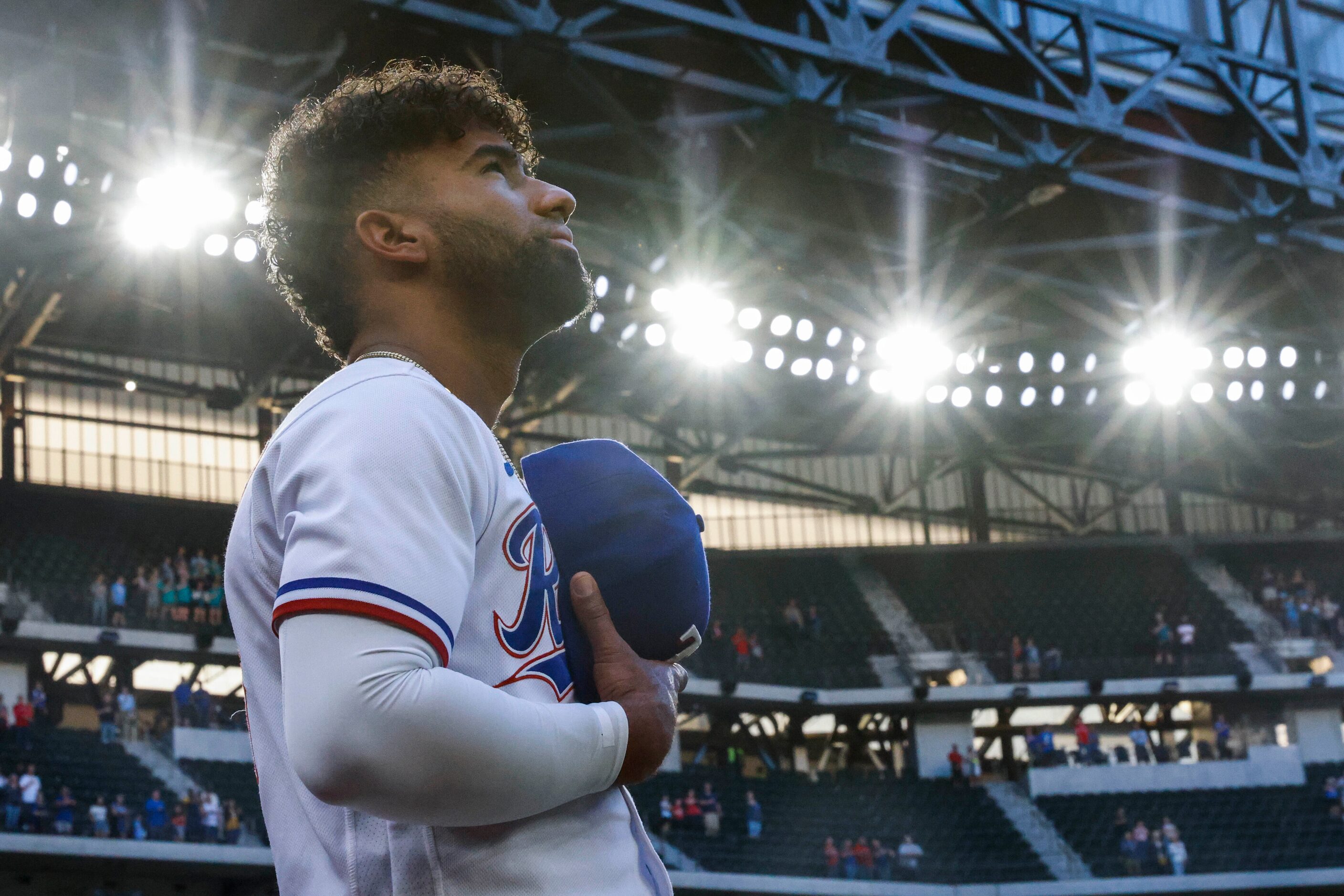 Texas Rangers third baseman Ezequiel Duran stands during the National Anthem before a...