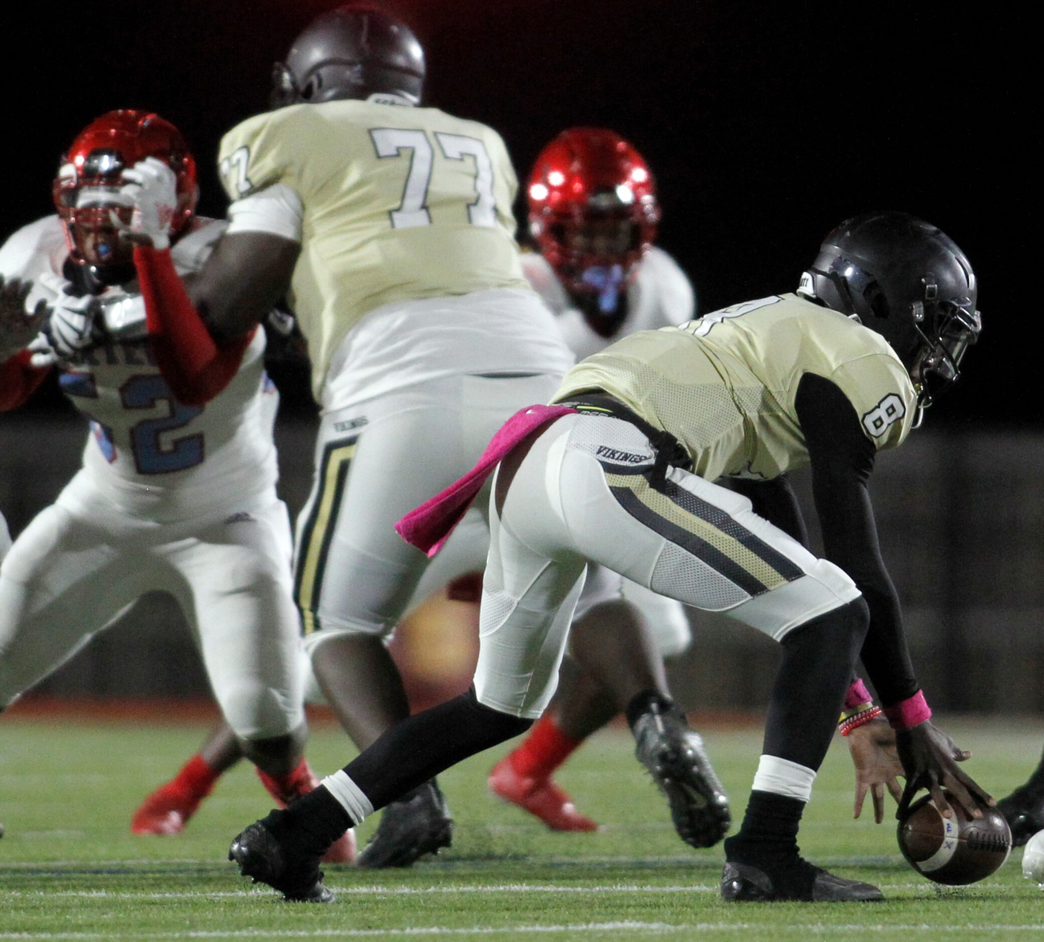 Dallas Pinkston quarterback Camyri Childress (8) reaches to retrieve a fumbled snap from...