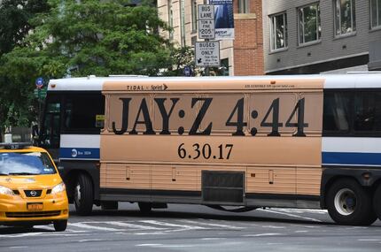 A bus advertising Jay-Z's hotly-anticipated album drives through New York City on June 29,...
