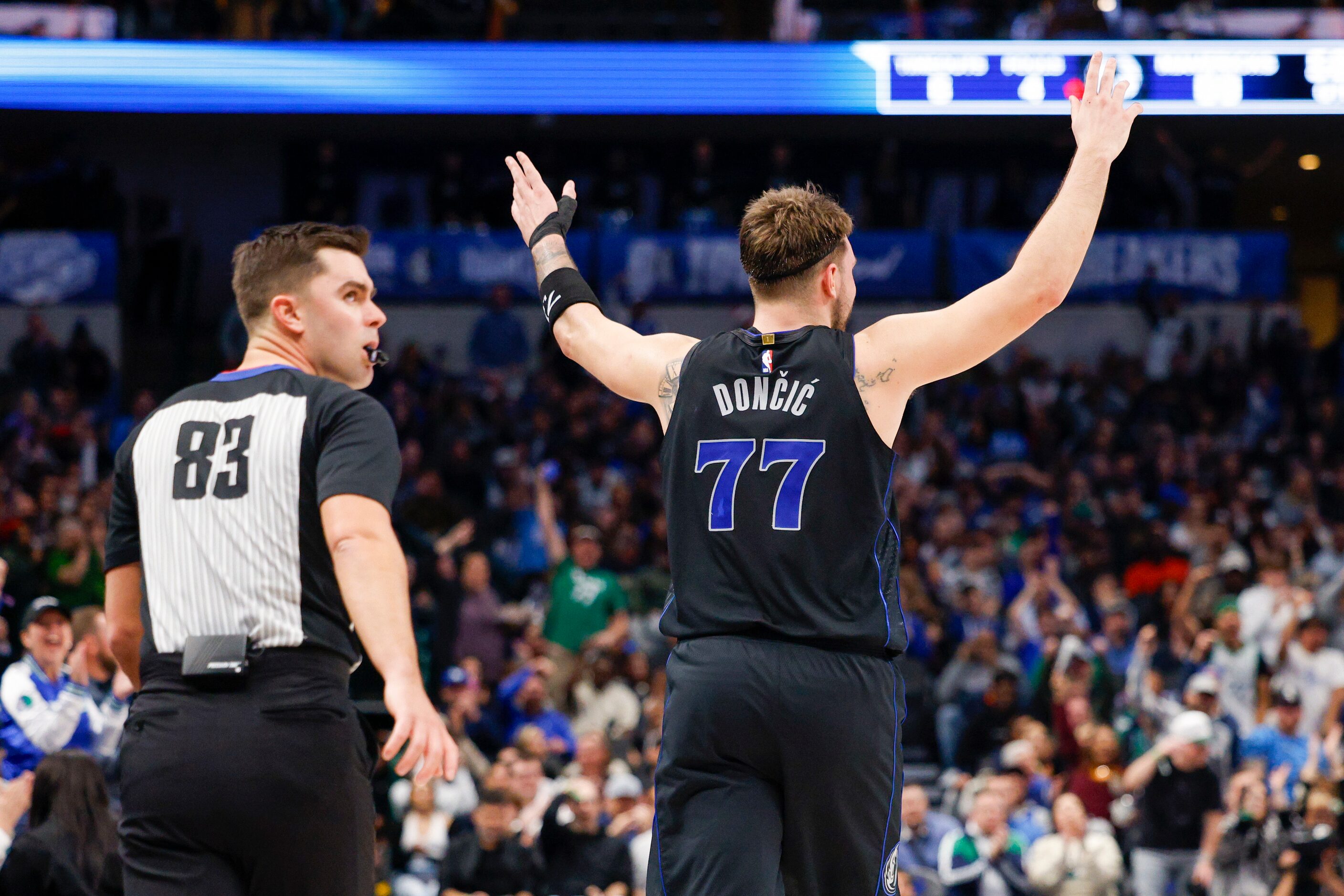 Dallas Mavericks guard Luka Doncic (77) celebrates after an assist gave him a triple-double...