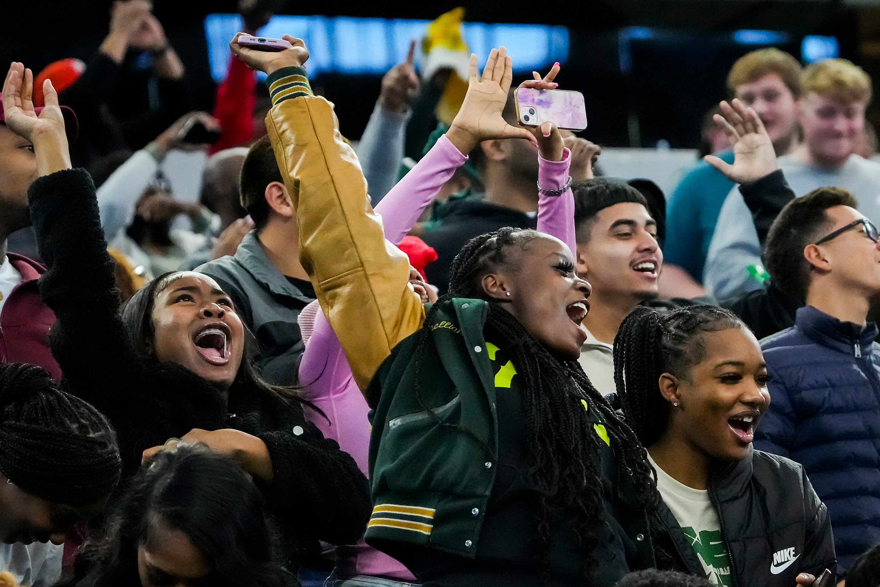 DeSoto fans cheer a touchdown during the first half of the 6A Division II state championship...