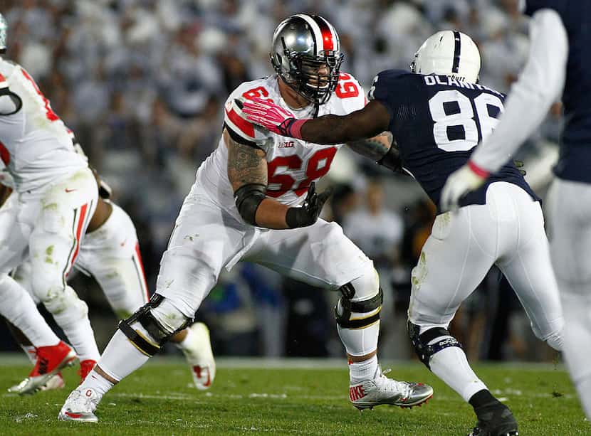 STATE COLLEGE, PA - OCTOBER 25:  Taylor Decker #68 of the Ohio State Buckeyes blocks during...