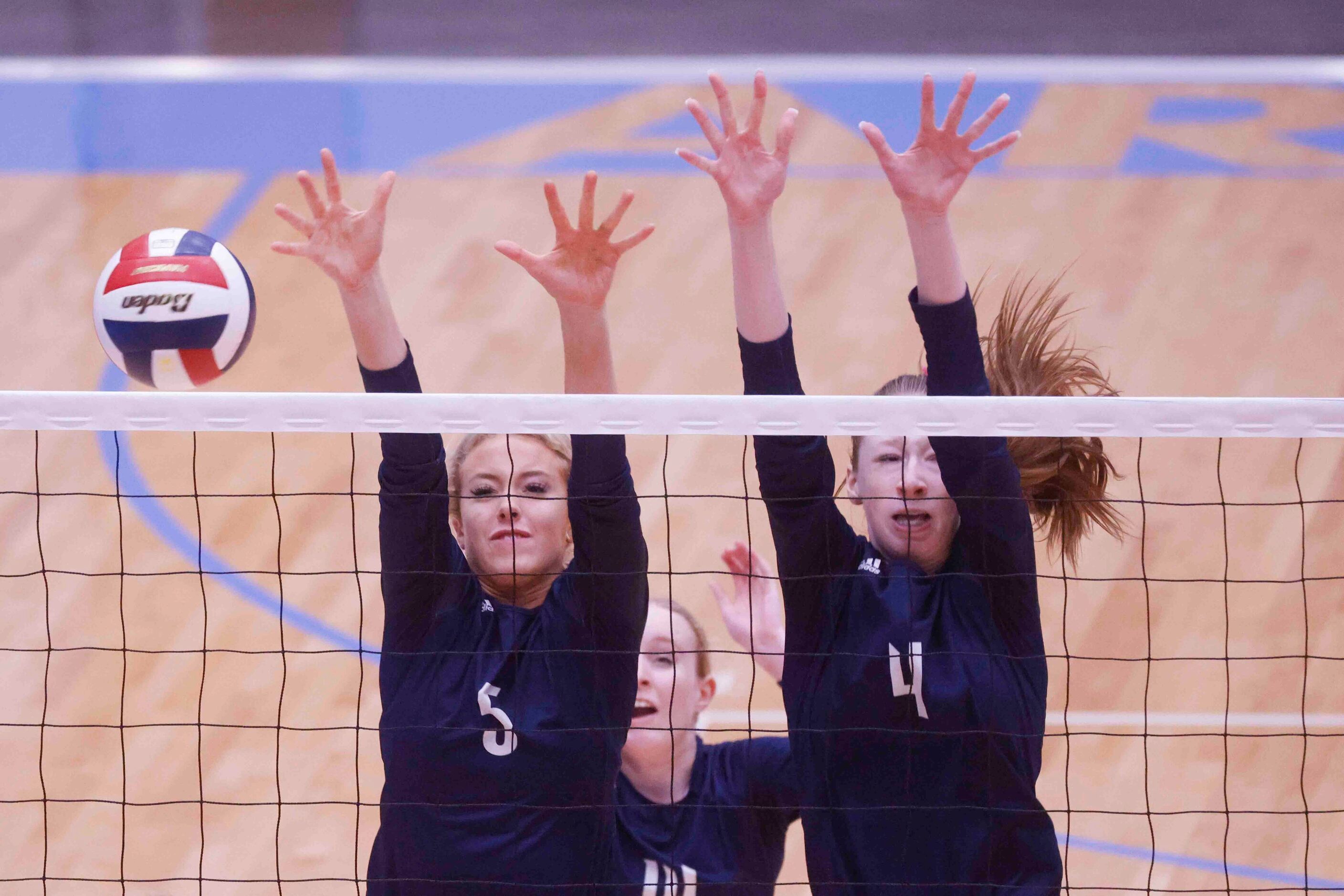 Flower Mound’s Audrey DeJesus (5) and Caroline Tredwell (4) blocks against Highland Park...