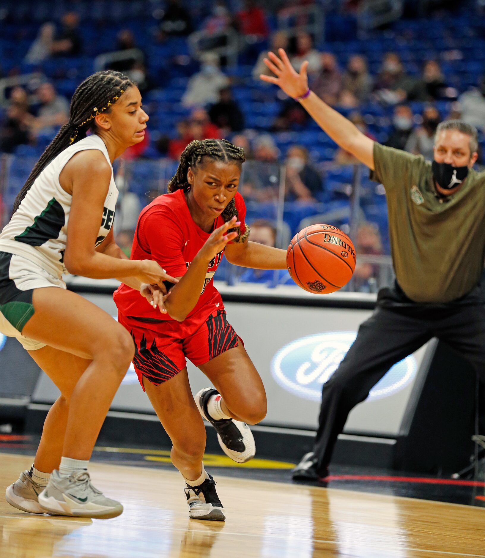 Frisco Liberty Jazzy Owens-Barnett #30 drives on Cedar Park Gisella Maul #21 as it appear to...