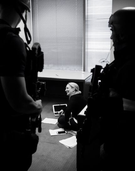 Writer Jamie Thompson visits with Dallas police department SWAT team members on Wednesday,...