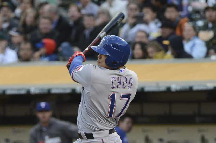 April 21, 2014; Oakland, CA, USA; Texas Rangers left fielder Shin-Soo Choo (17) hits a solo...