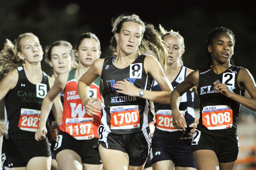 Hebron's Rachel Jones, center, and other girls compete in the girls 1600 meter race during...