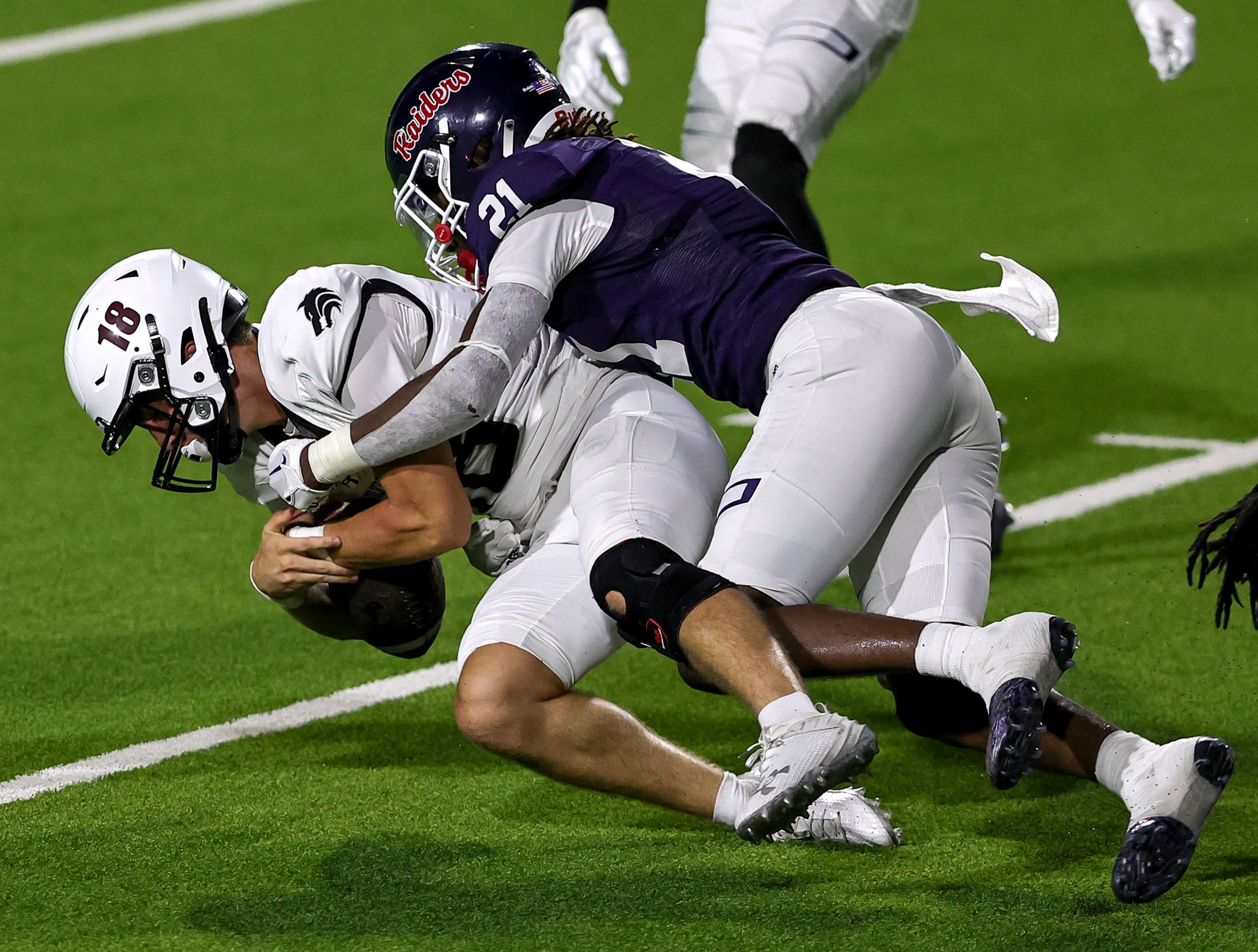 Mansfield Timberview quarterback Casen Cappelletti (18) scrambles for a first down and is...