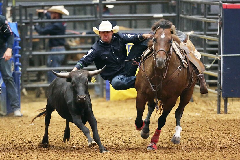 Cody Harmon competes in steer wrestling on Teacher Appreciation Night at the Mesquite Rodeo...