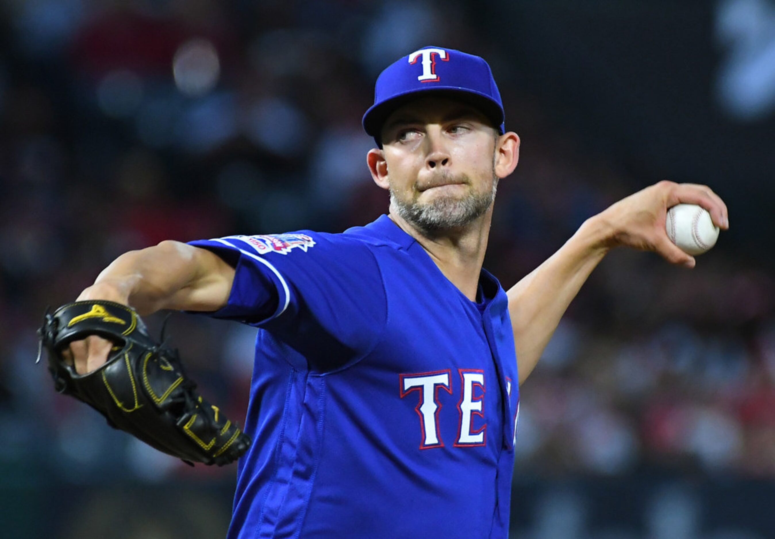 ANAHEIM, CA - MAY 25: Mike Minor #23 of the Texas Rangers pitches in the third inning of the...