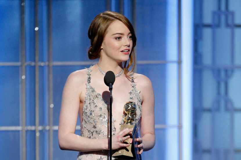 This image released by NBC shows Emma Stone with the award for best actress in a motion...