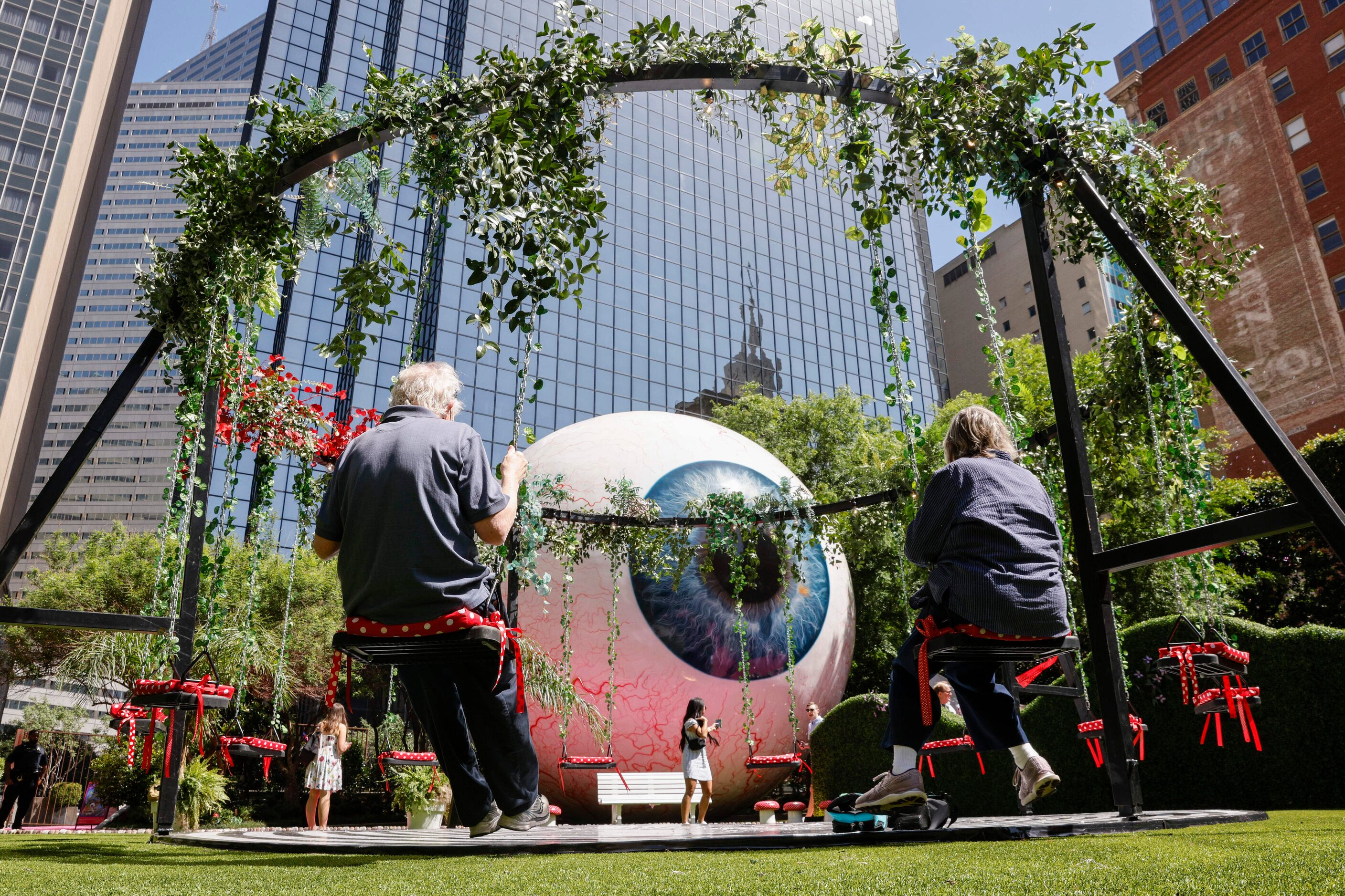 Steve Rowan (left) swings with his wife Dorothy Rowan at the Eyeboretum on Friday.