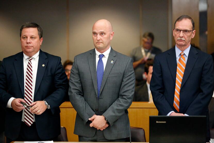 Roy Oliver was flanked by his attorneys Miles Brissette (left) and Bob Gill before the...