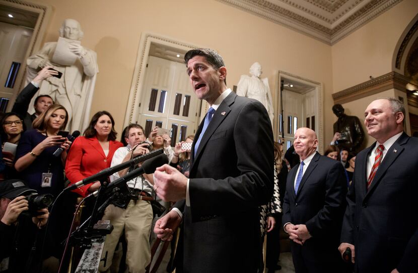 Speaker of the House Paul Ryan, R-Wisconsin (joined at right by, House Ways and Means...