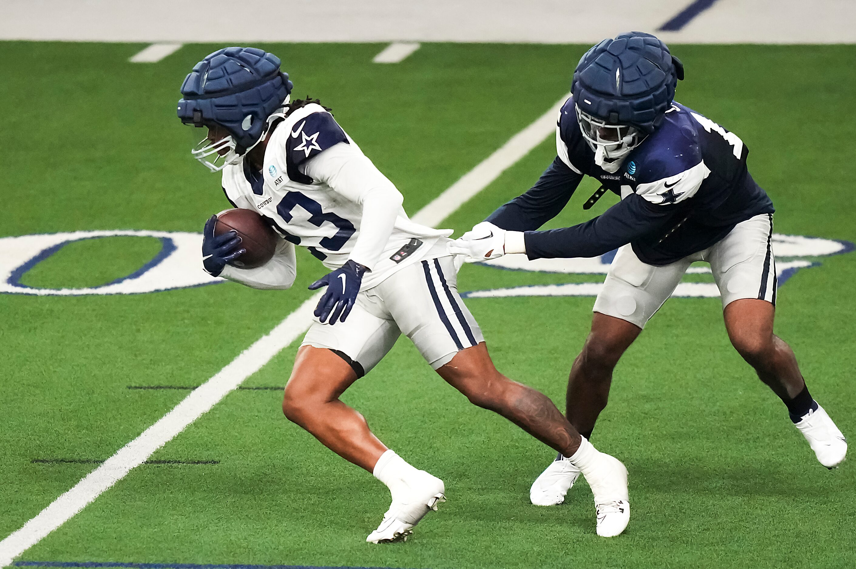 Dallas Cowboys running back Rico Dowdle (23) gets past linebacker Jabril Cox (14)during the...