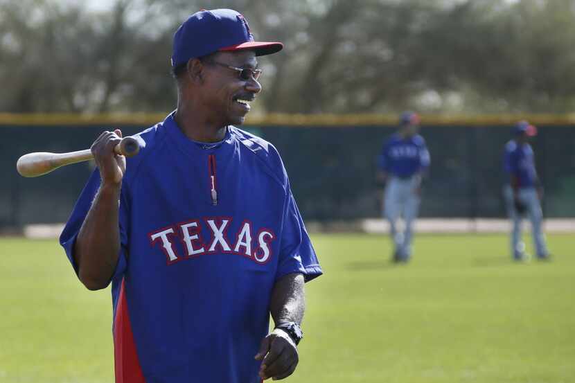 Texas manager Ron Washington shares a laugh with his players during Texas Rangers baseball...
