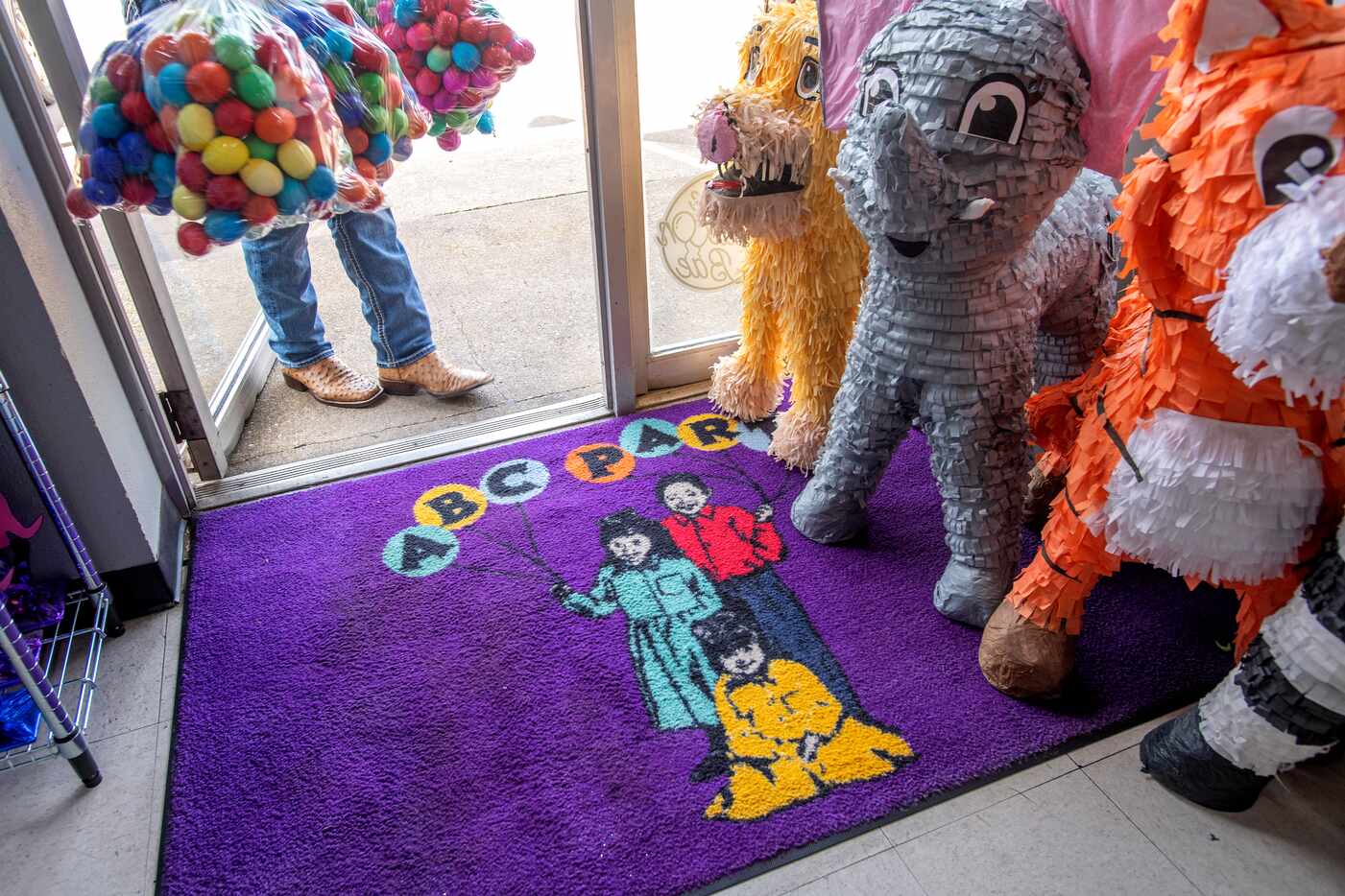 A welcome mat at ABC Party displays the shop's logo, created when the De La Fuente family's...