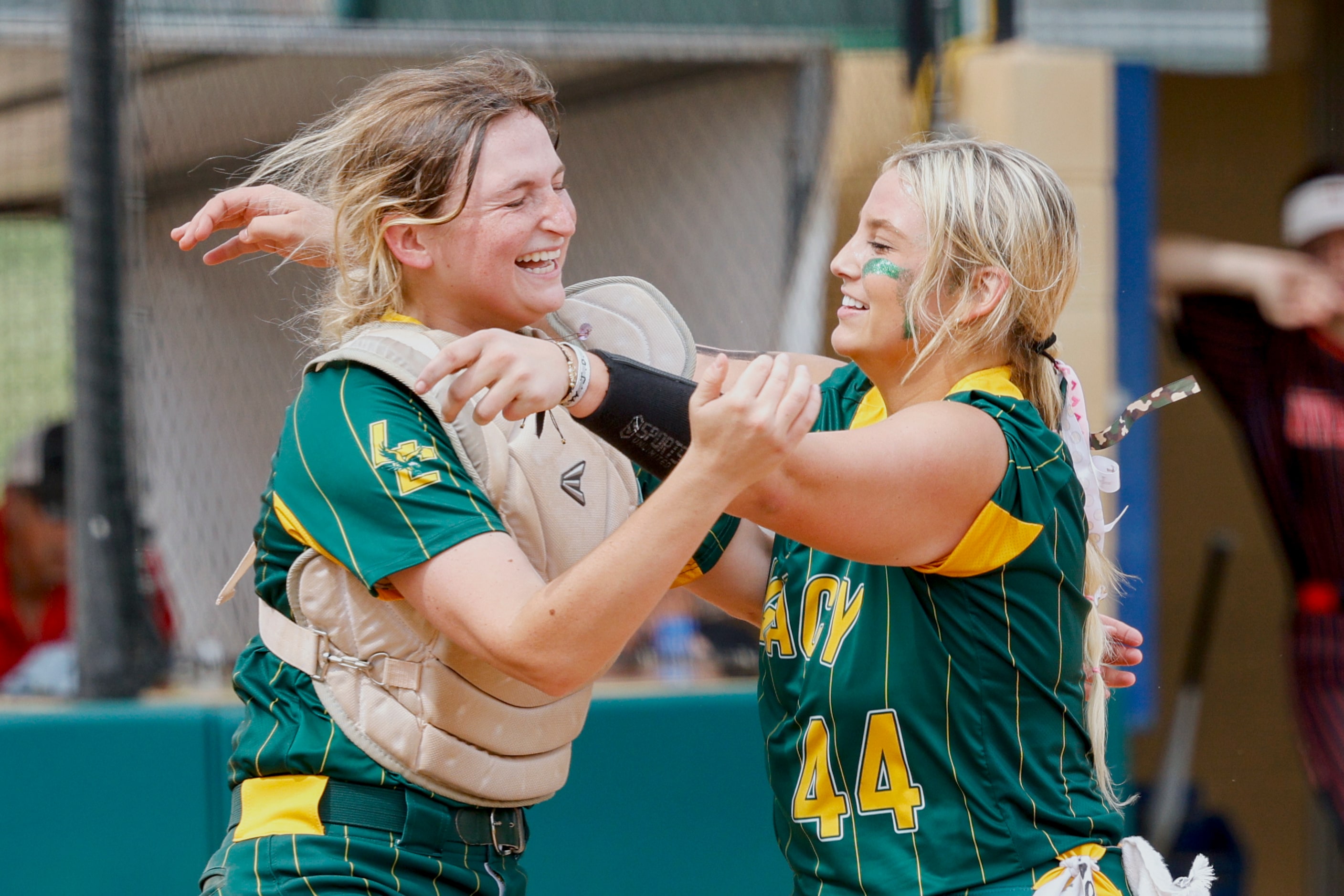 Frisco Legacy Christian catcher Jackie Purtell (left) hugs pitcher Ronnie Johnson (44) after...