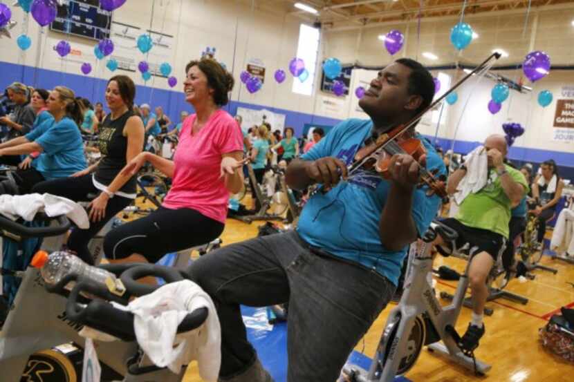  Pedaling to fight ovarian cancer is even more fun when Richmond Punch plays the violin.