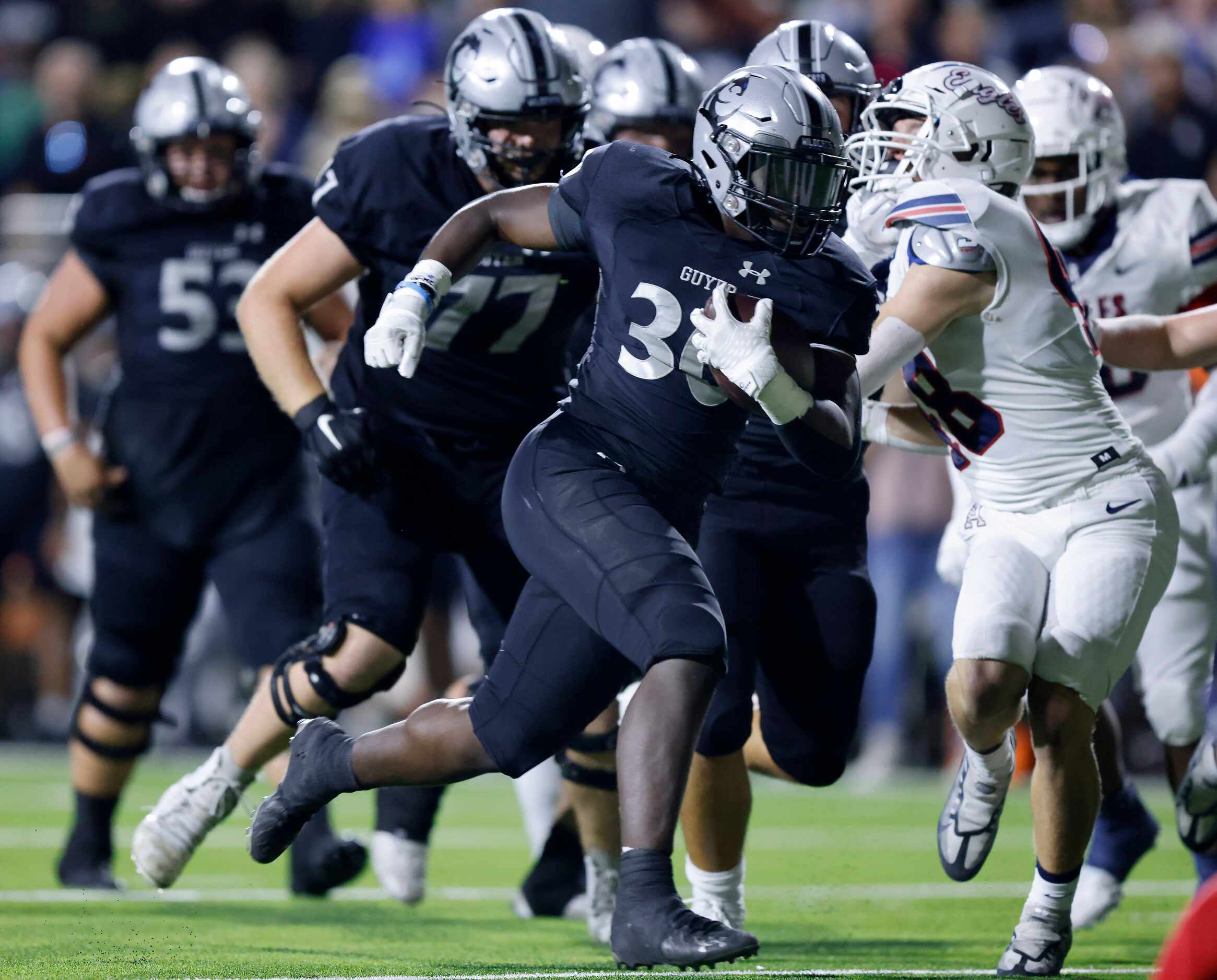 Denton Guyer running back Ahmed Yussuf (30) eludes the Allen defense enroute to a third...