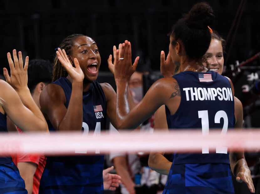 USA’s Chiaka Ogbogu (24) celebrates with Jordan Thompson (12) after the team defeated...