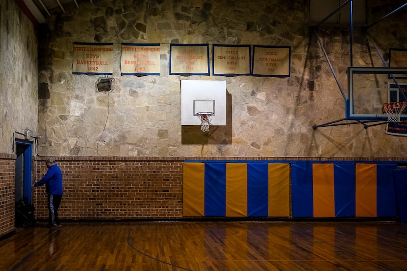 The banners from Slidell High School's 1942 and 1943 state championships hang on the wall of...