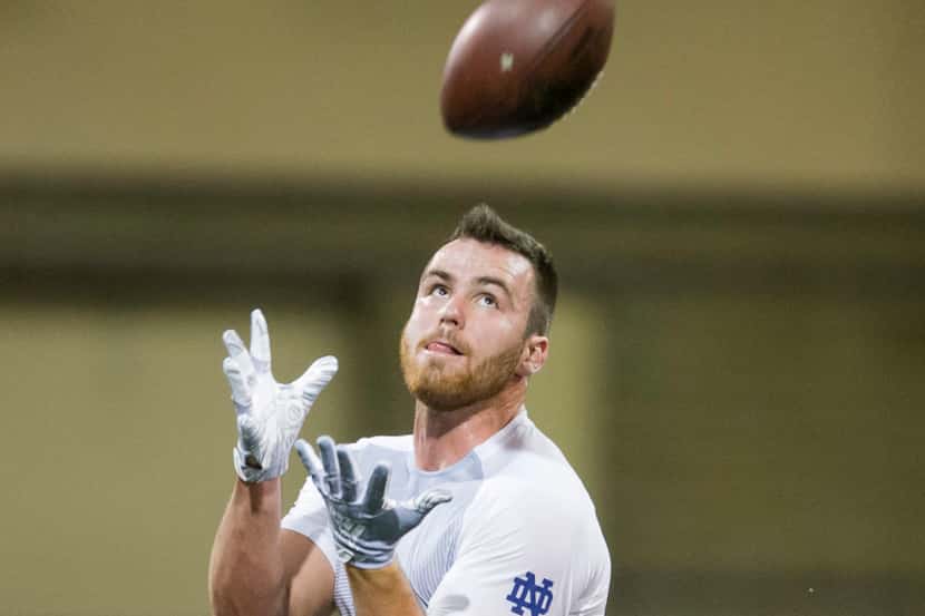 Durham Smythe runs drills during Notre Dame Pro Day football workouts in South Bend, Ind.,...