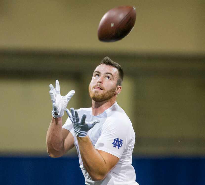 Durham Smythe runs drills during Notre Dame Pro Day football workouts in South Bend, Ind.,...