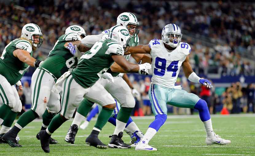 Dallas Cowboys defensive end Randy Gregory (94) is double teamed by the New York Jets...