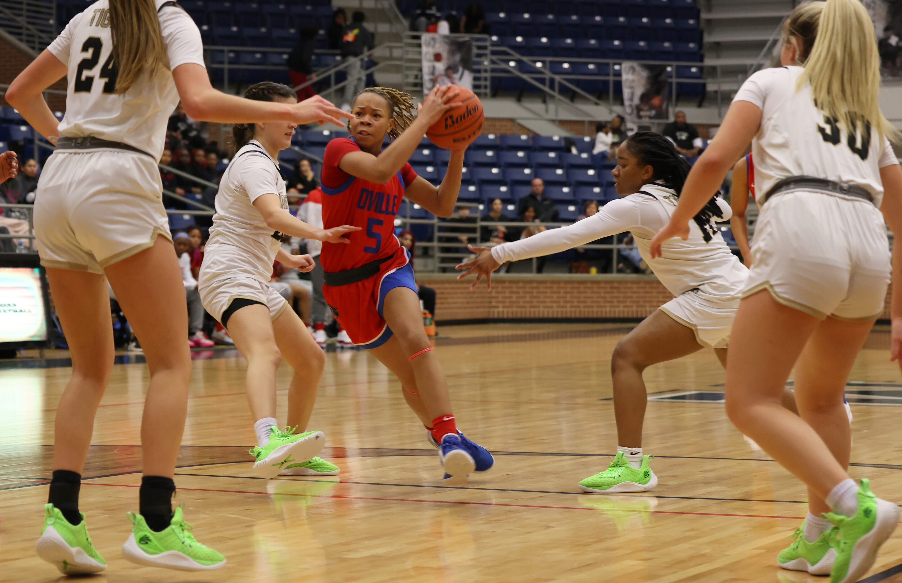 Duncanville guard Laila Coleman (5) drives the lane as she is defended by Mansfield...