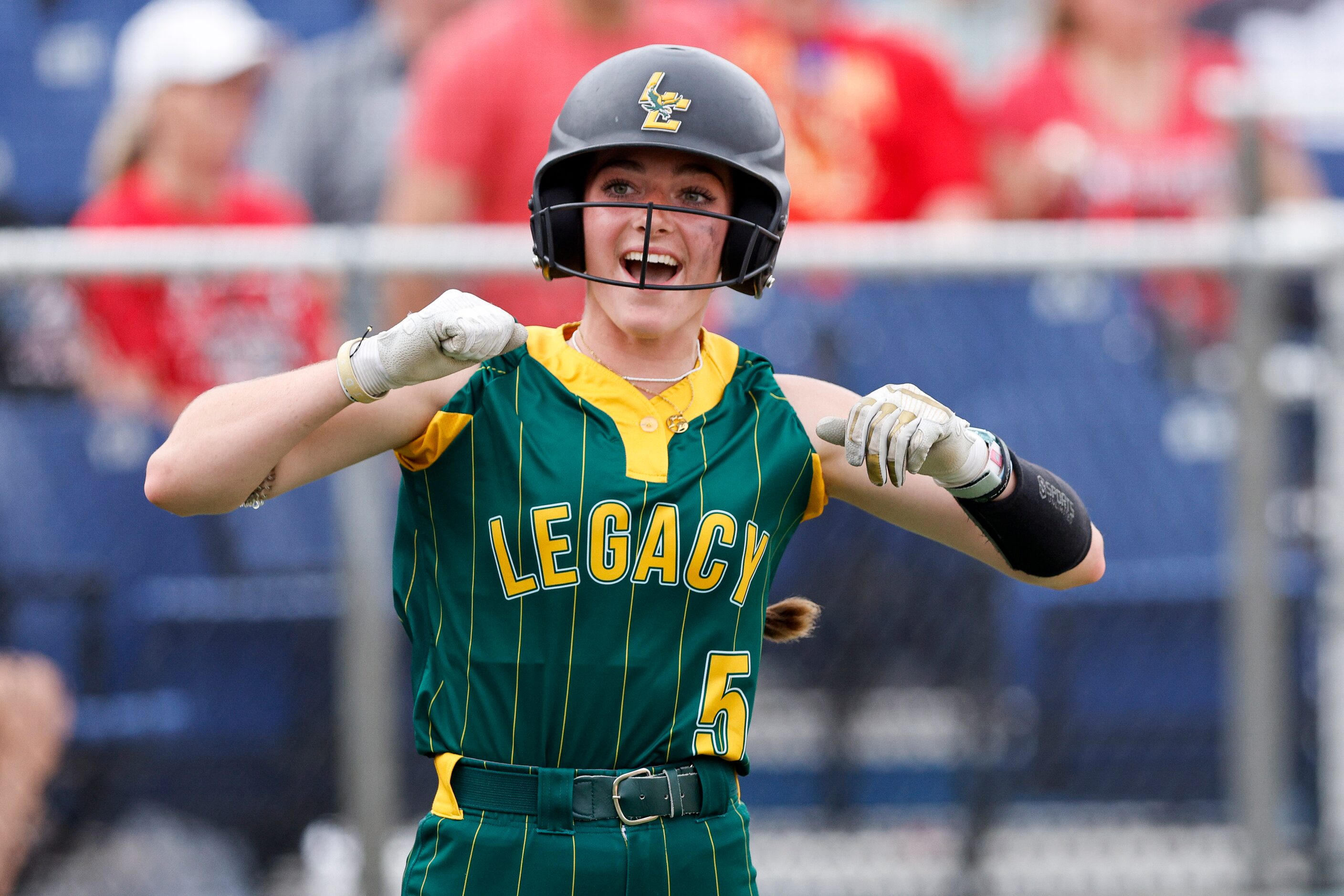 Frisco Legacy Christian outfielder Alexandra Thomas (5) celebrates after scoring a run...