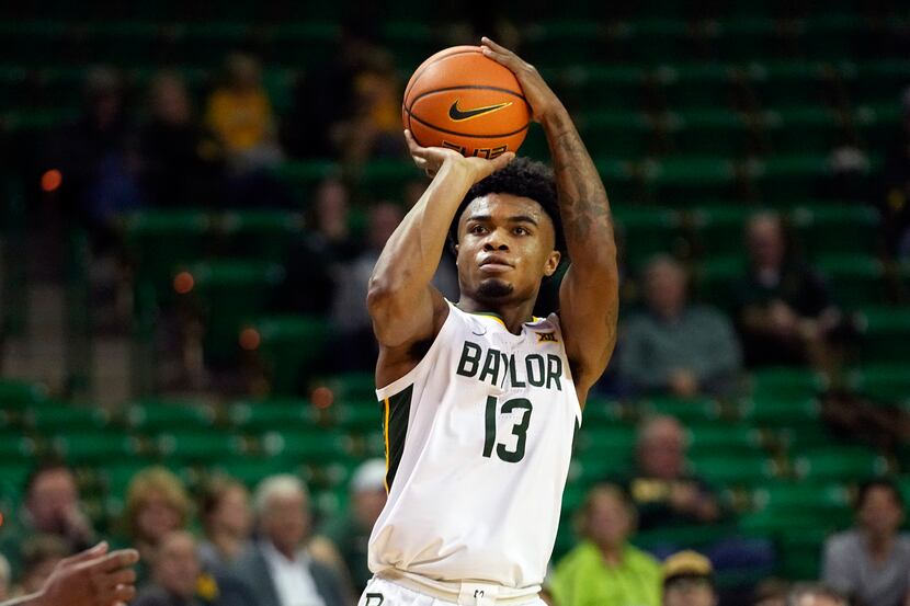 Baylor guard Langston Love (13) shoots during the second half of an NCAA college basketball...