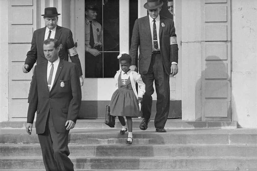 In this November 1960 file photo, U.S. deputy marshals escort 6-year-old Ruby Bridges from...