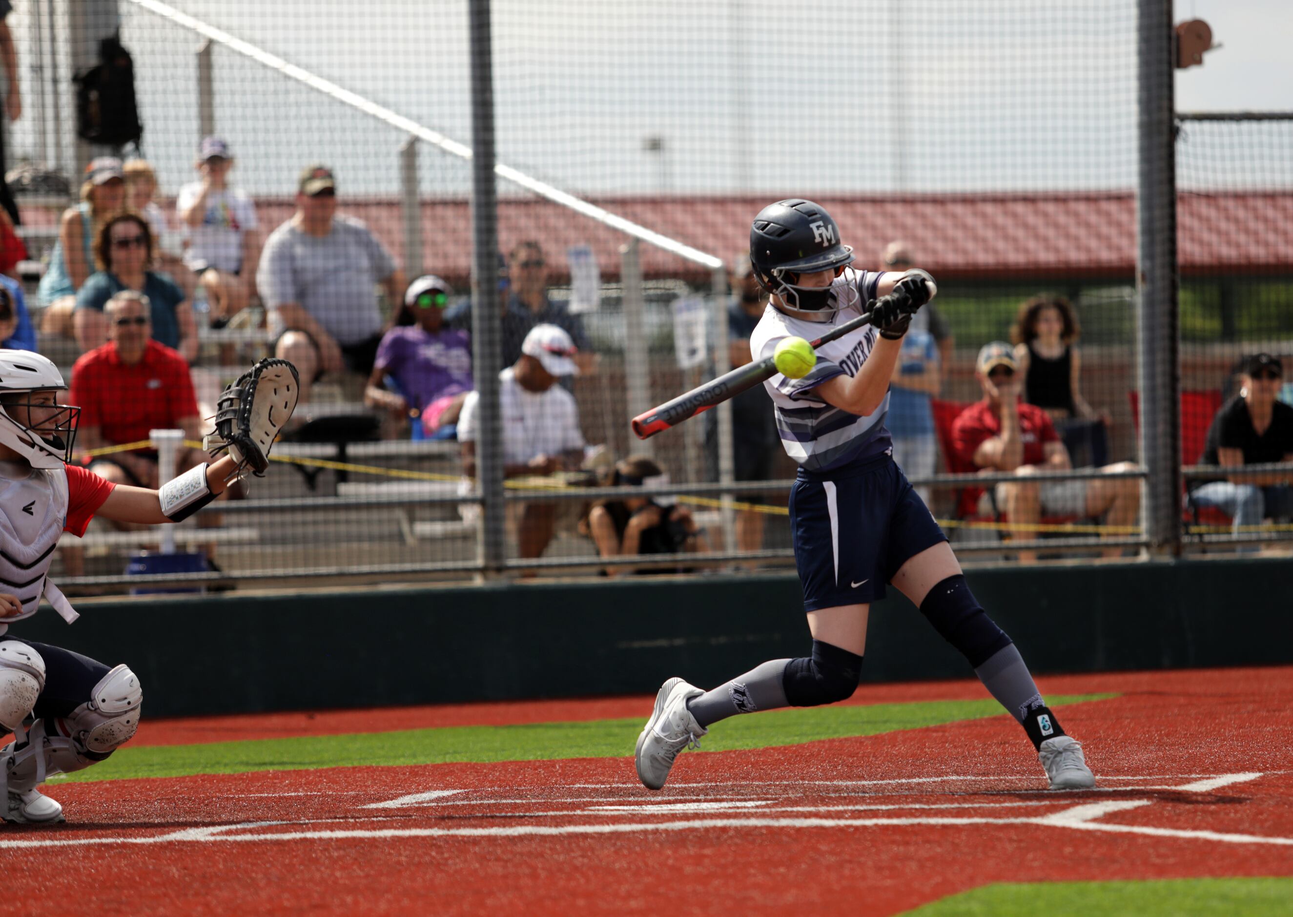Flower Mound High School player #8, Carsyn Lee, hits the ball during a softball game against...