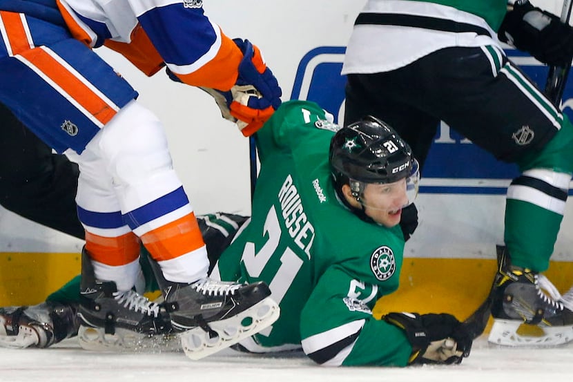 Dallas Stars left wing Antoine Roussel (21) is pushed down during the first period by New...