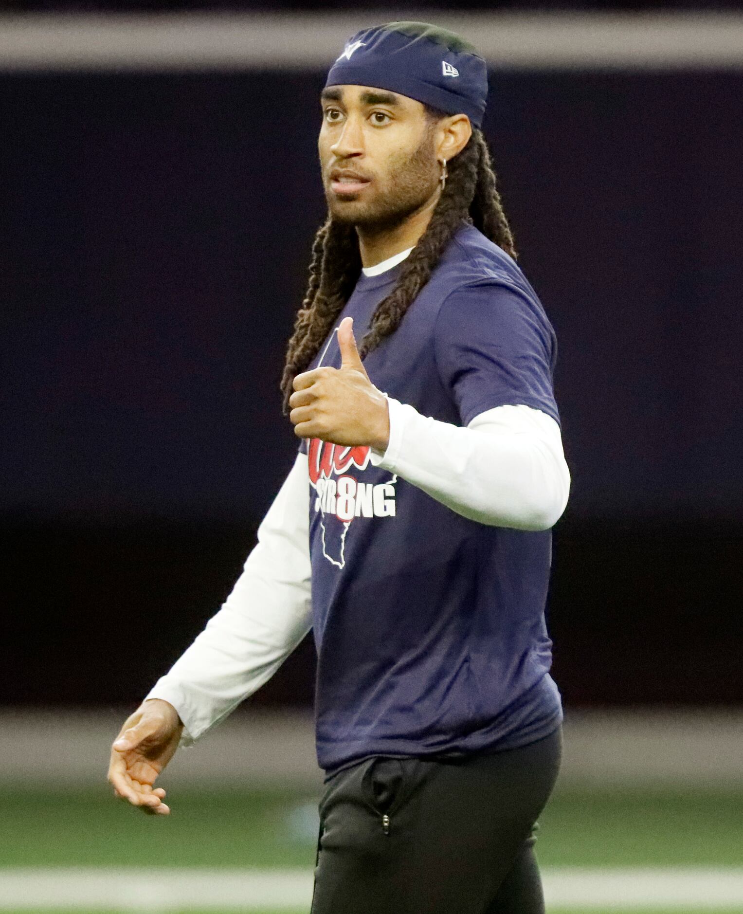 Cornerback Stephon Gilmore gives his approval after a play as the Dallas Cowboys held mini...