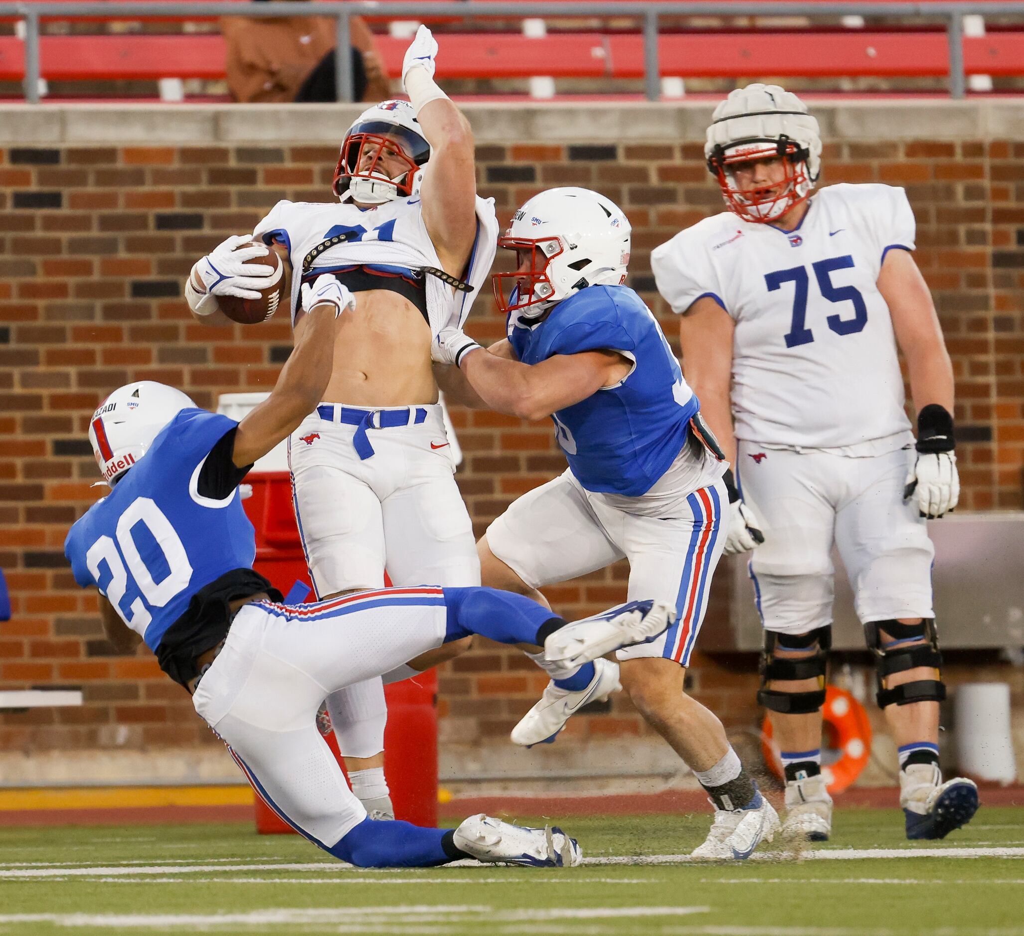 Southern Methodist Mustangs running back Tyler Lavine (31) is tackled during the SMU...