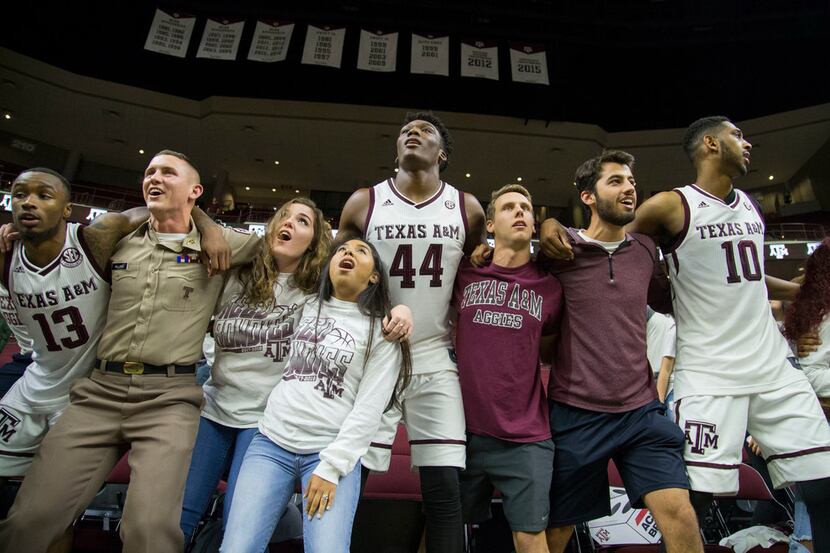 Texas A&M forward Robert Williams (44) sings the Aggie War Hymn with fans after a 78-60 win...