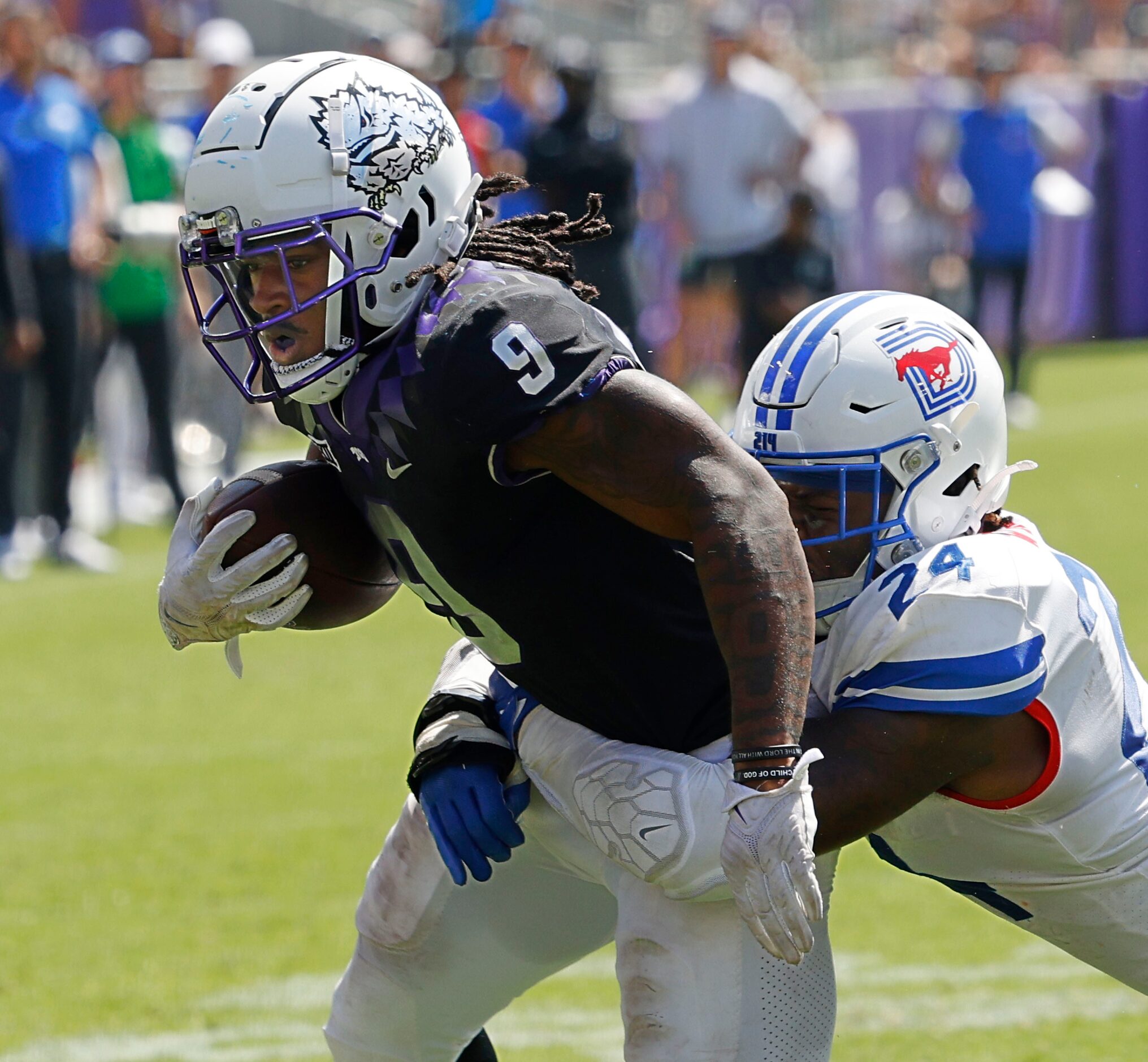 TCU Horned Frogs running back Emani Bailey (9) carries the ball against Southern Methodist...