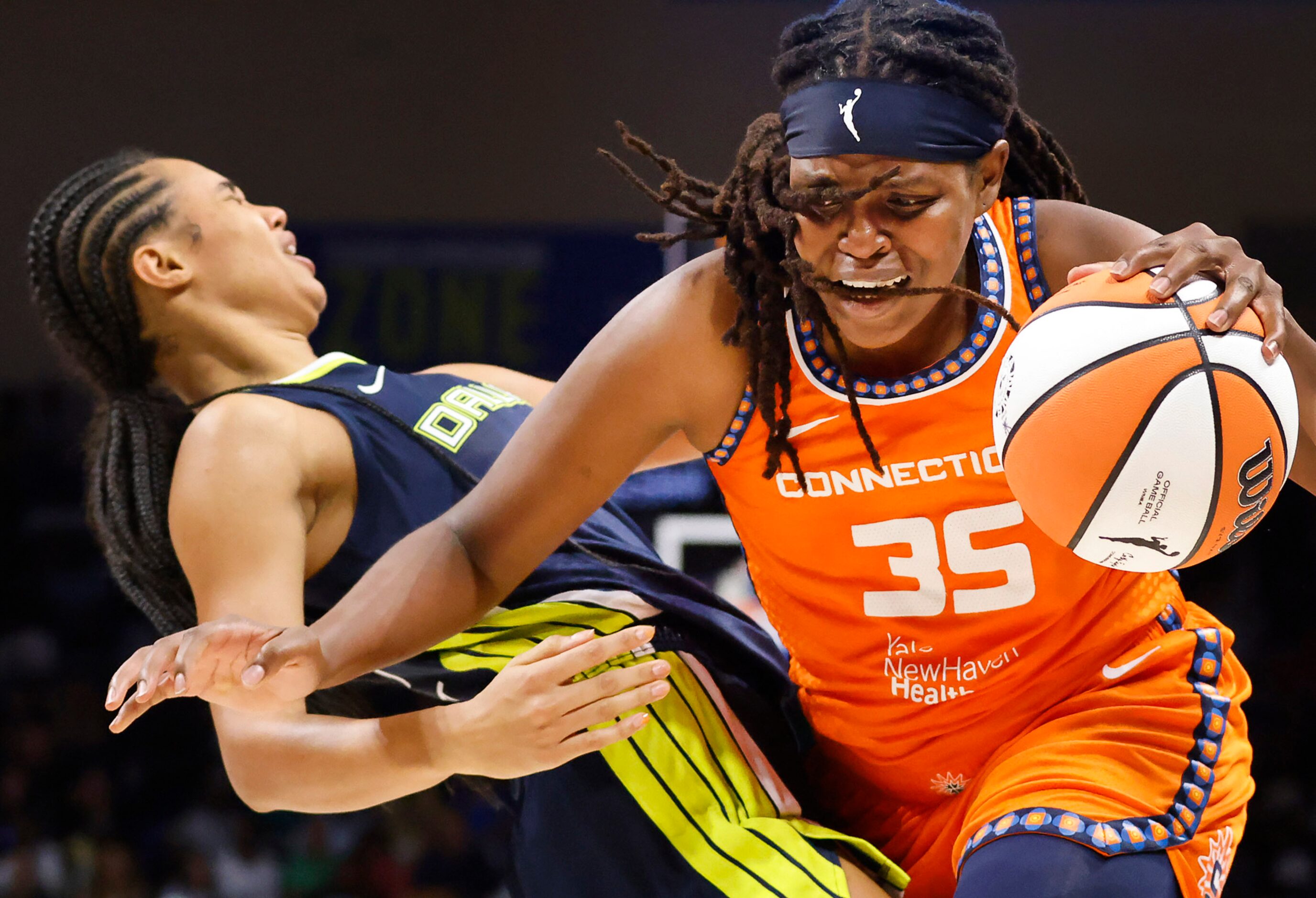 Connecticut Sun forward Jonquel Jones (35) drives into Dallas Wings forward Satou Sabally...