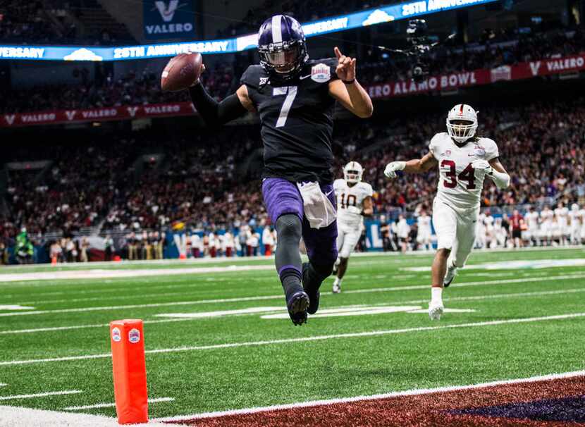 TCU Horned Frogs quarterback Kenny Hill (7) crosses the goal line for a touchdown during the...