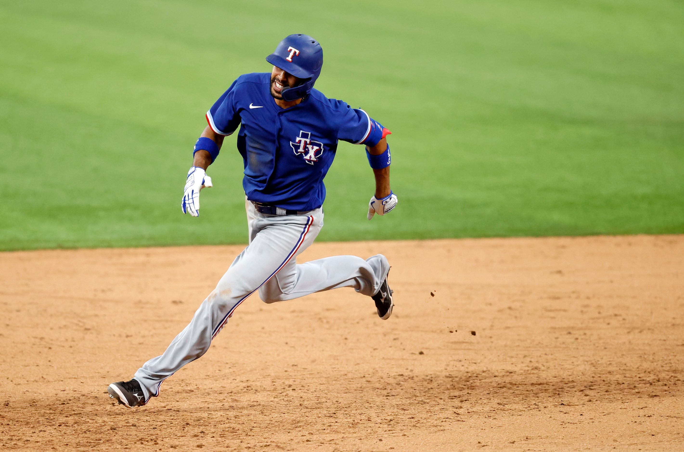 Texas Rangers Yadiel Rivera races around second base for a triple during an intrasquad...