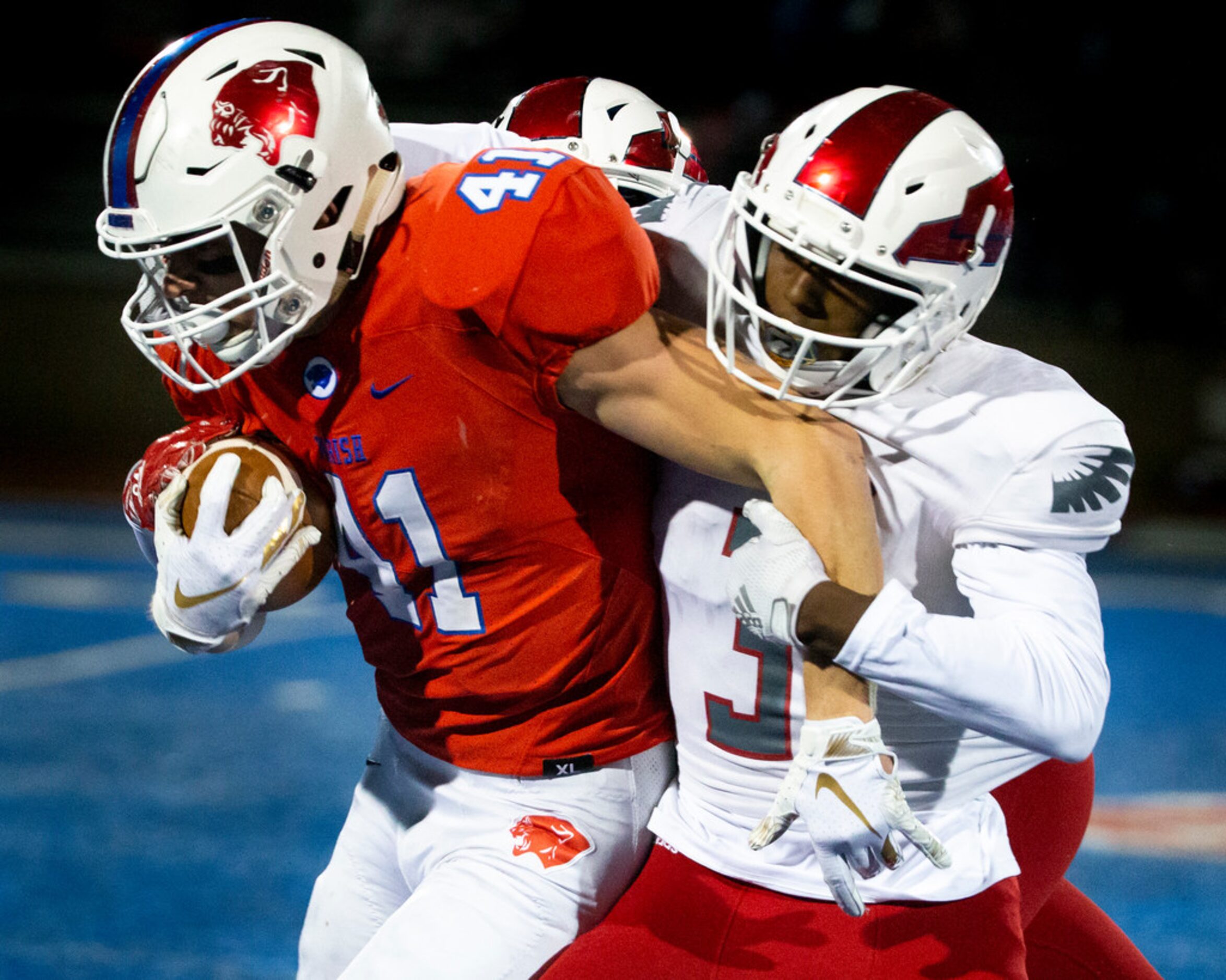 Parish Episcopal wide receiver Andrew Merrick (41) by Bishop Dunne defensive back Nicholas...