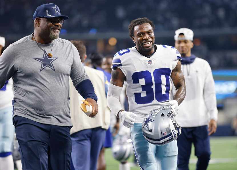 Dallas Cowboys cornerback Anthony Brown (30) is all smiles after his pick-six against the...
