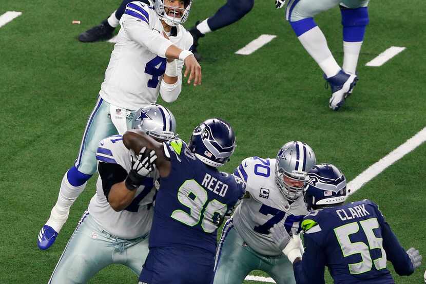 Dallas Cowboys quarterback Dak Prescott (4) passes the ball during the first half of play...