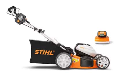 Orange and black lawn mower with Stihl written on the side