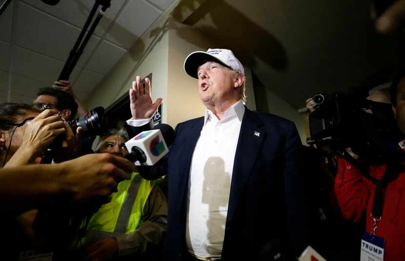  Republican presidential hopeful Donald Trump speaks to reporters after arriving for a visit...