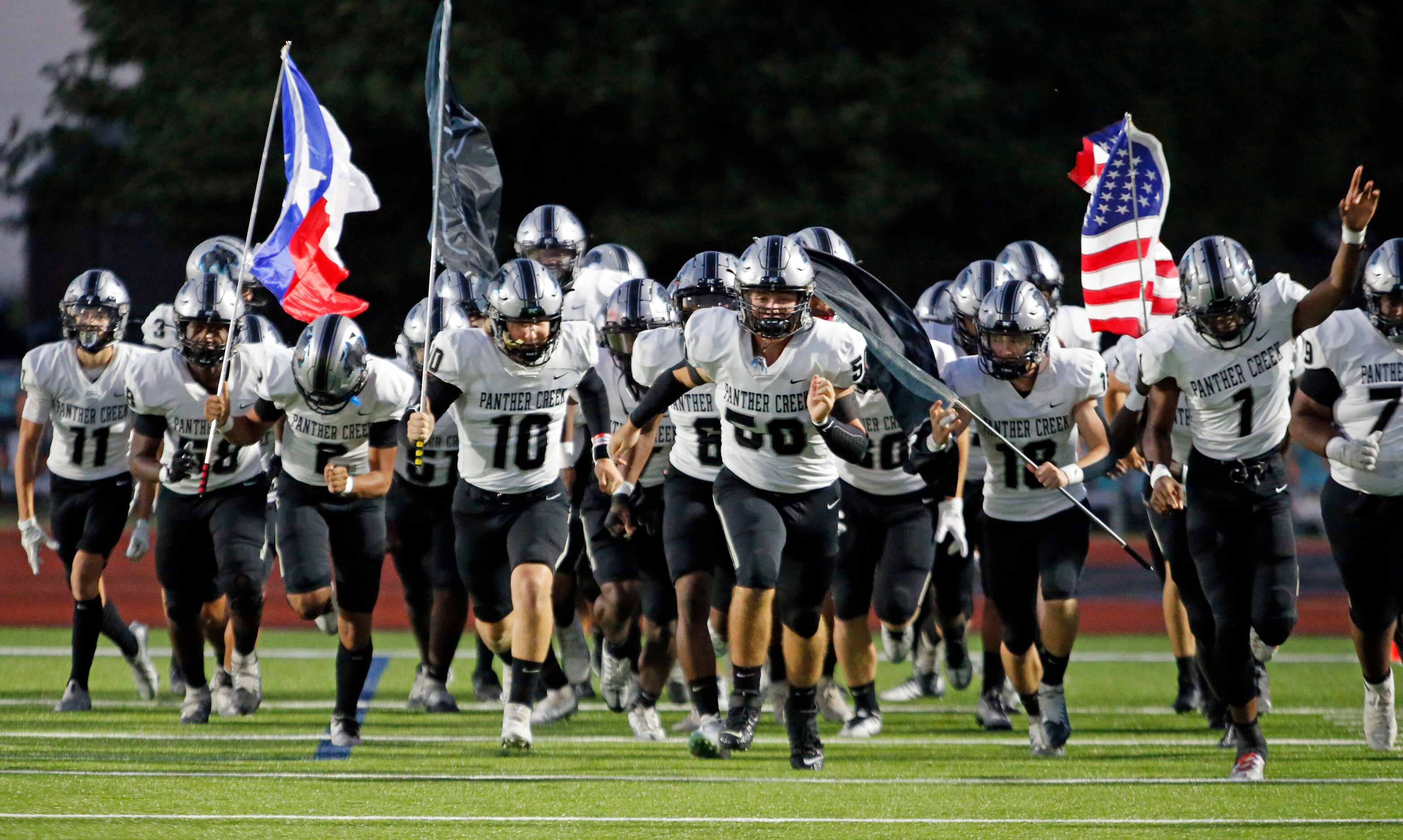 Frisco Panther Creek high takes the field before the start of the first half of a high...